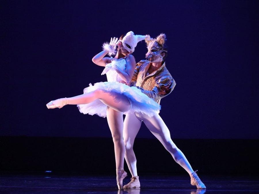 Couple dancing with masks